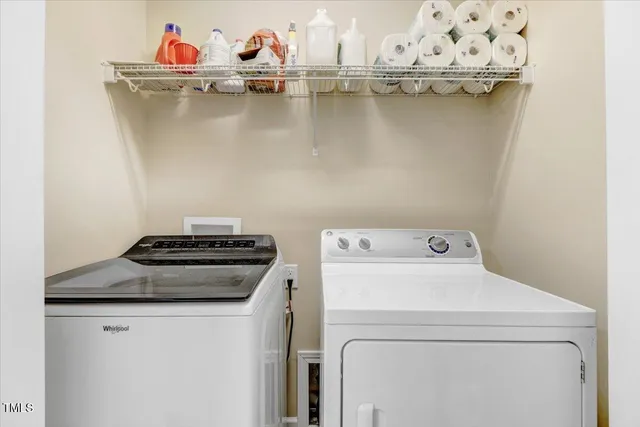 a bedroom with a bed and dresser