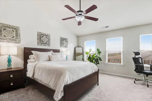 a view of a workspace with a window and chair