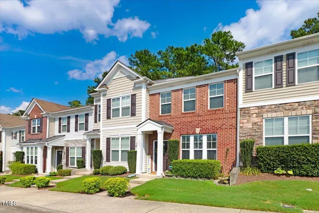 a outdoor space with a table and chairs