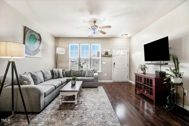 a view of a dining room and hall with wooden floor