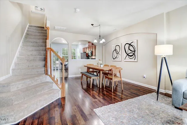 a view of a dining room with furniture and wooden floor