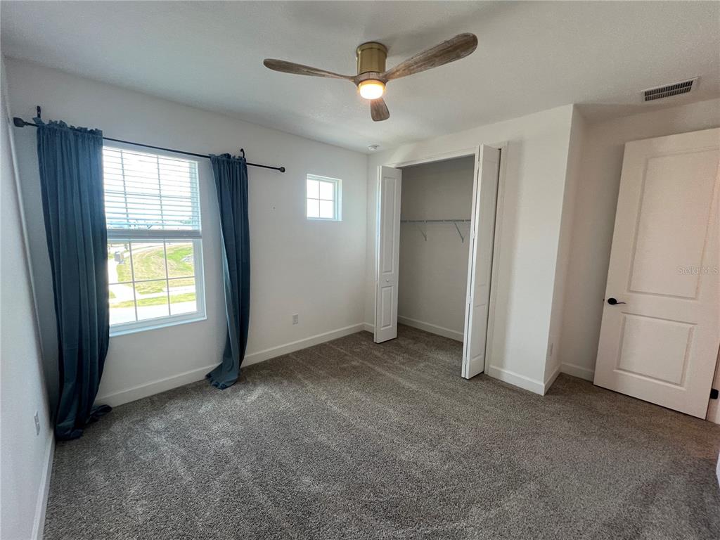 931 Signet Drive Apollo Beach, FL 33572 - Photo 18 of 22 a view of an empty room with a window