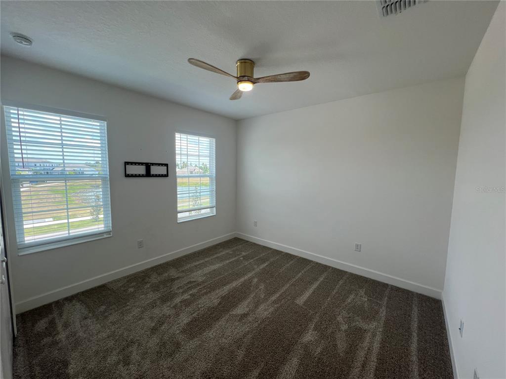 931 Signet Drive Apollo Beach, FL 33572 - Photo 19 of 22 a view of an empty room with a window