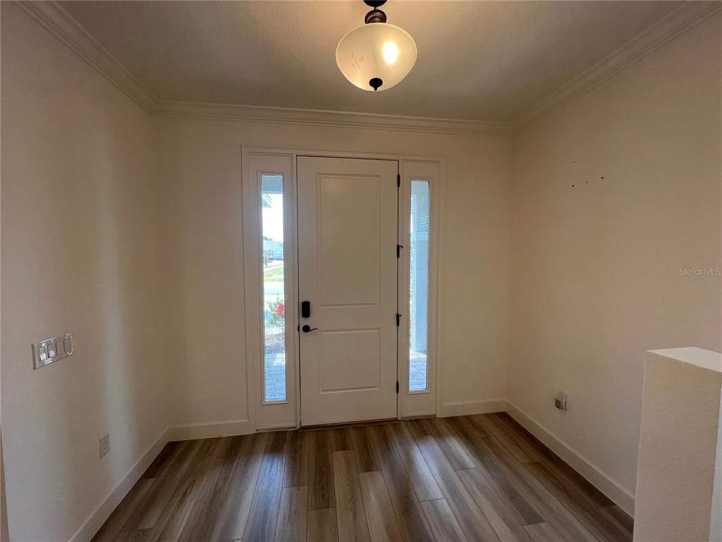 931 Signet Drive Apollo Beach, FL 33572 - Photo 3 of 22 a view of an empty room and wooden floor