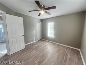 7786 Scarlet Court Naples, FL 34104 - Photo 11 of 14 a view of an empty room with a window