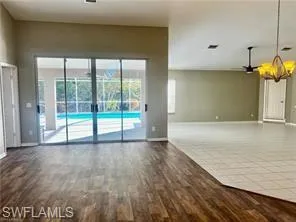a view of a room with wooden floor