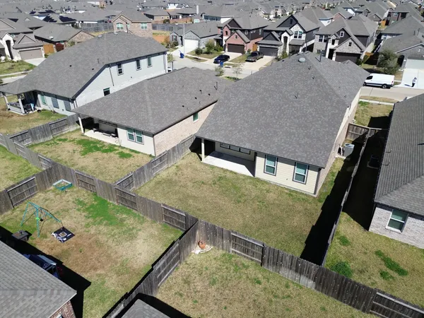 an aerial view of a house with swimming pool