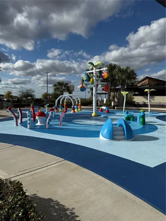 a view of a swimming pool with an outdoor seating