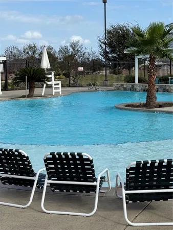 a table and chairs in front of a yard