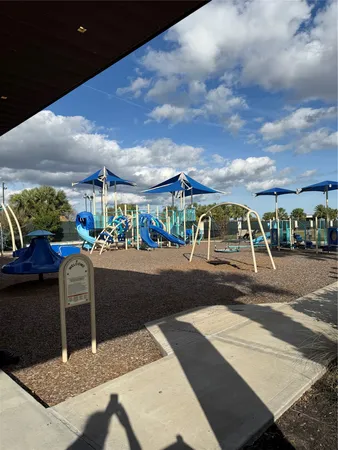 a view of a street with cars on both side of road