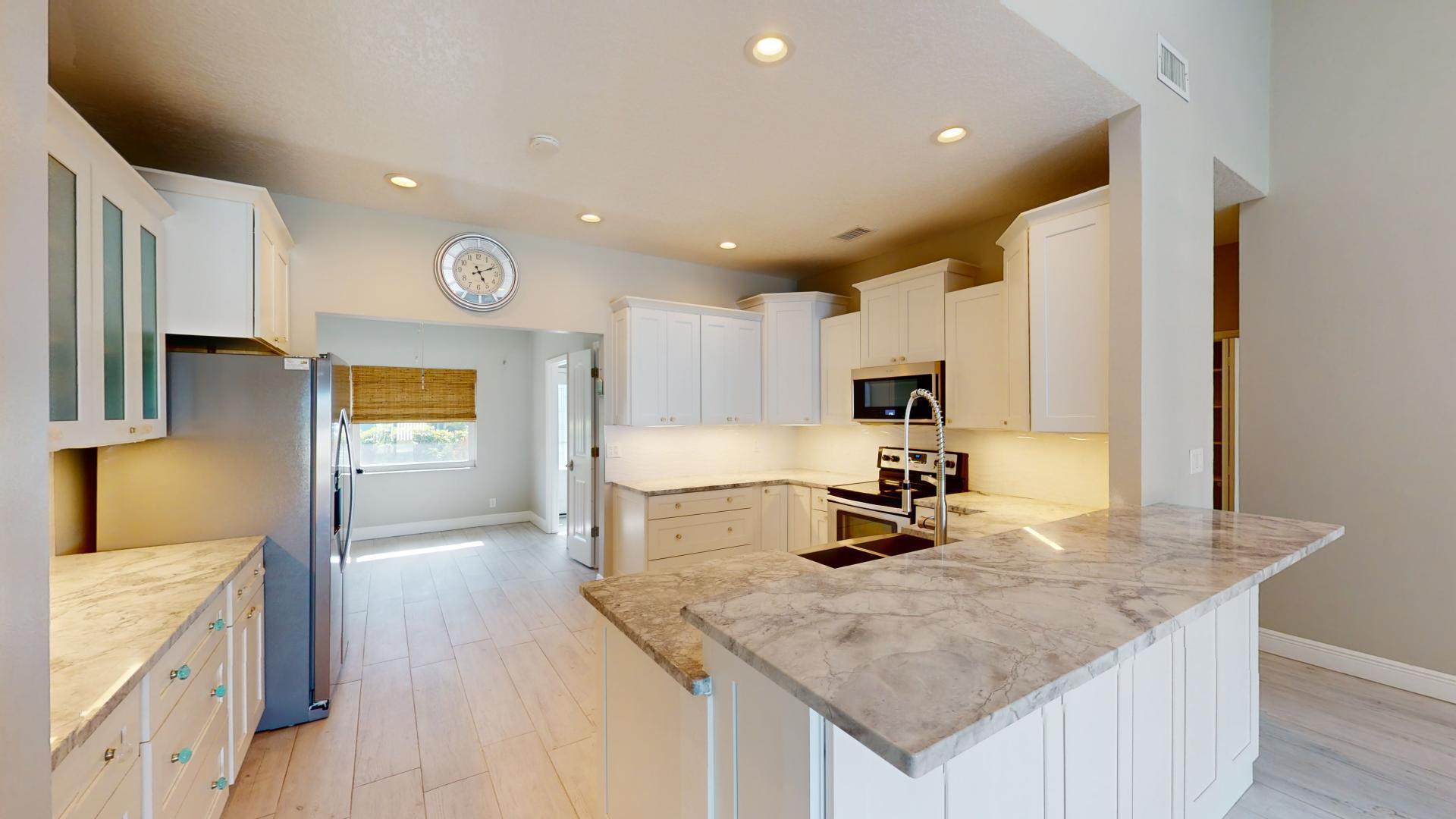 959 N Highway Indialantic, FL 32903 - Photo 11 of 70 a kitchen with a sink refrigerator and microwave