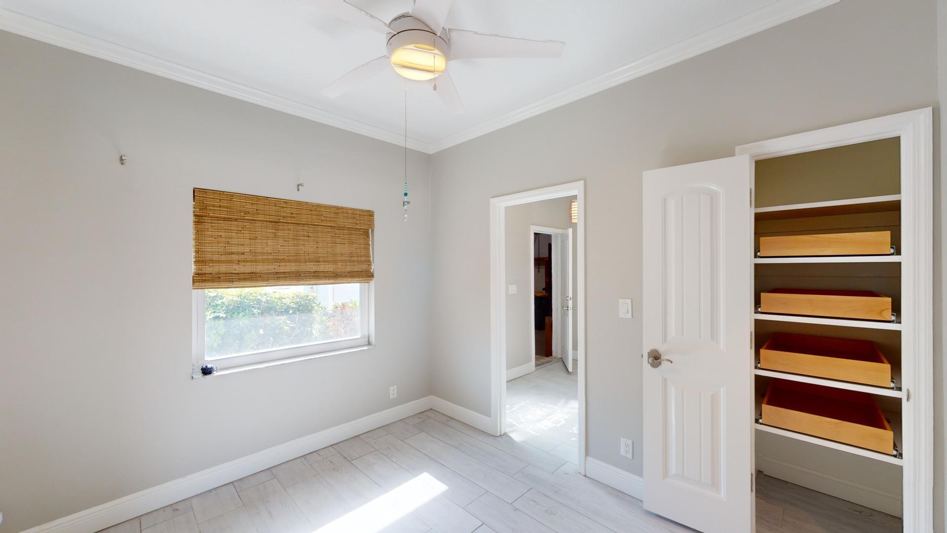 959 N Highway Indialantic, FL 32903 - Photo 13 of 70 a view of an empty room with a window and wooden floor