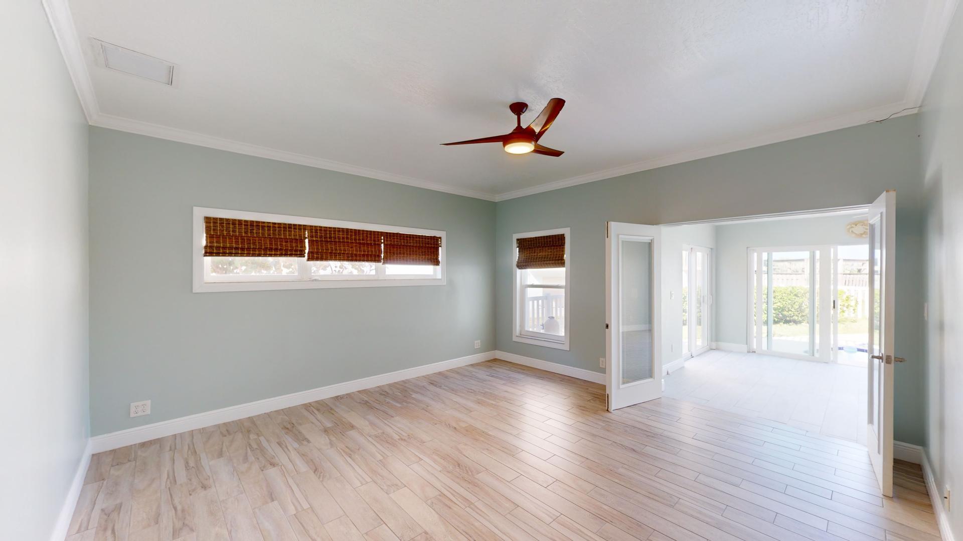 959 N Highway Indialantic, FL 32903 - Photo 41 of 70 a view of empty room with wooden floor and fan