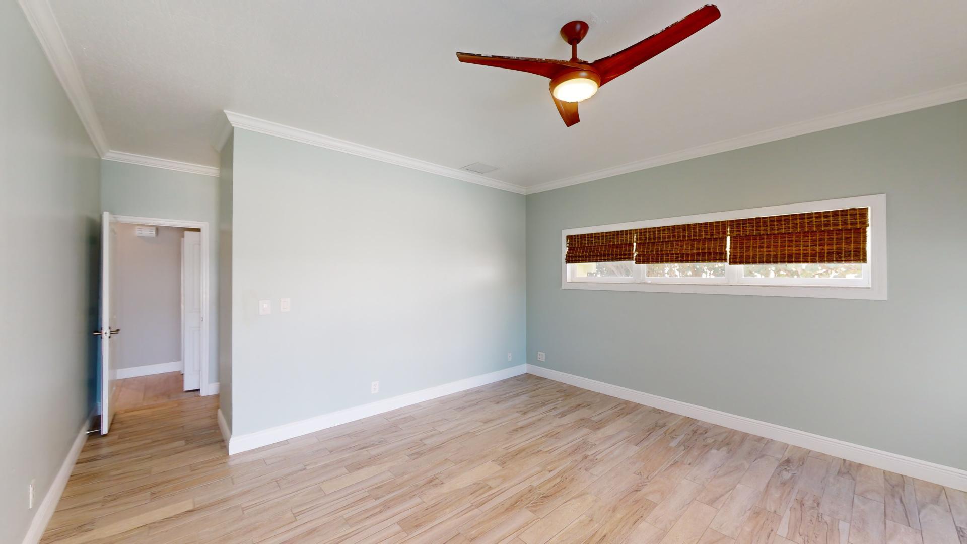 959 N Highway Indialantic, FL 32903 - Photo 47 of 70 an empty room with wooden floor and windows