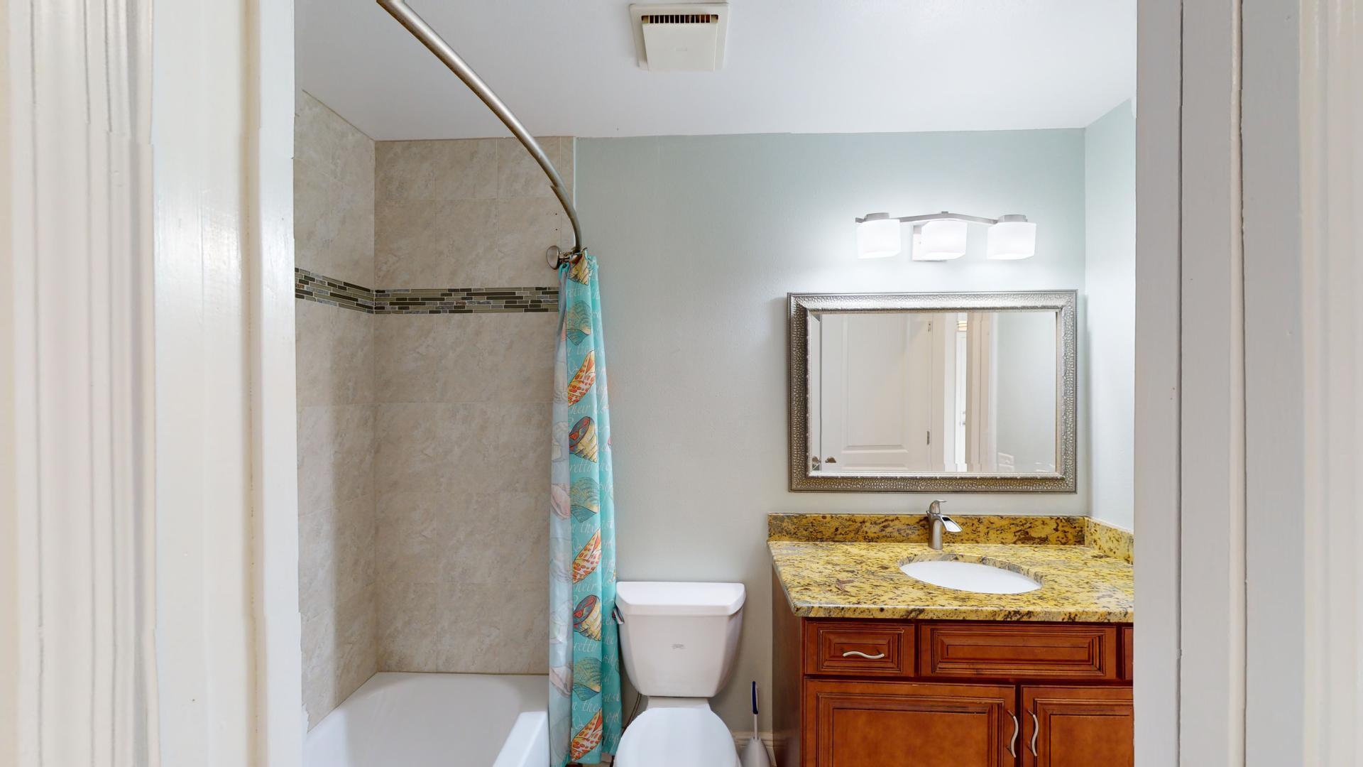 959 N Highway Indialantic, FL 32903 - Photo 59 of 70 a bathroom with a granite countertop toilet sink and mirror