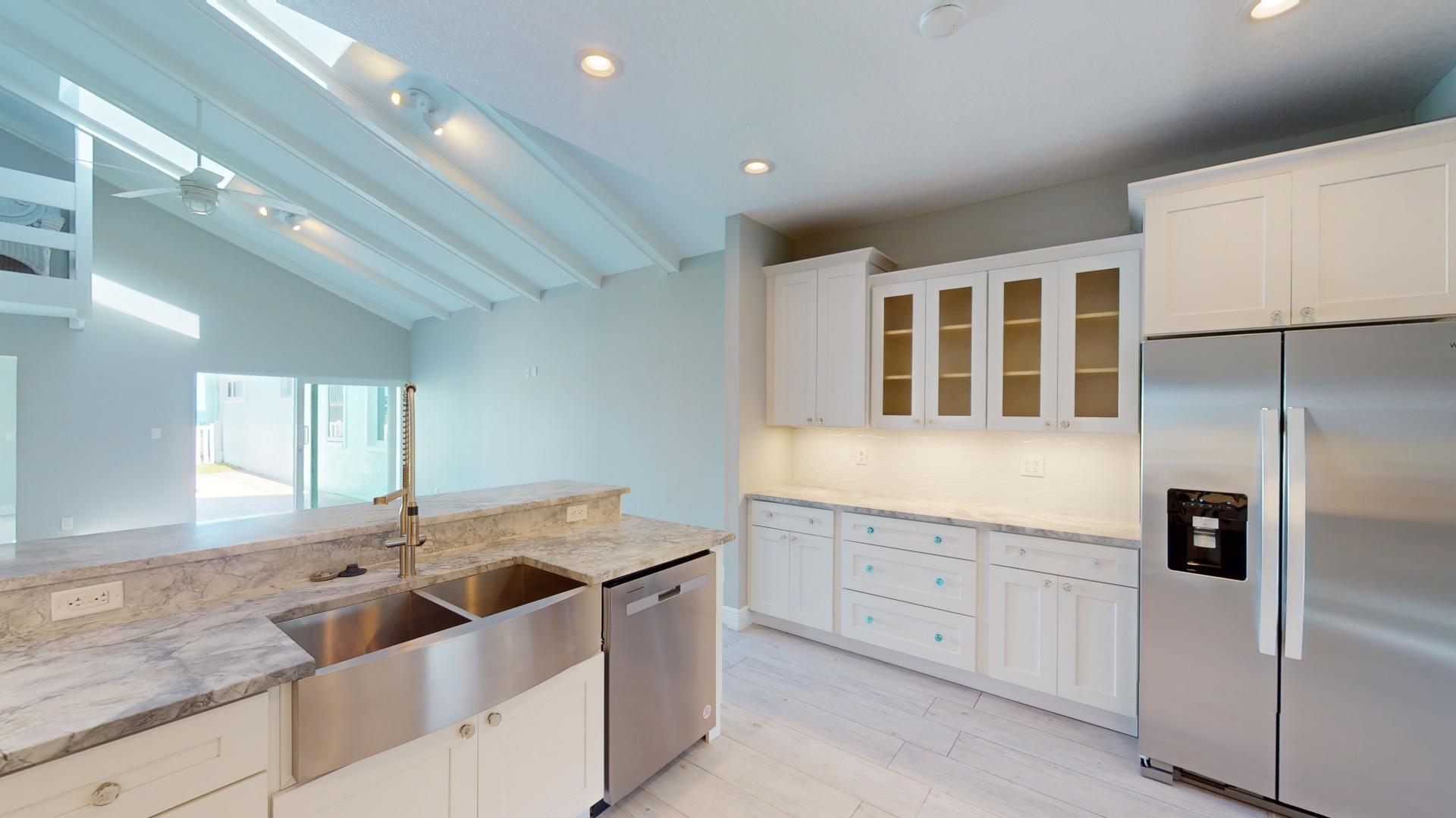 959 N Highway Indialantic, FL 32903 - Photo 8 of 70 a kitchen with stainless steel appliances granite countertop a sink and a refrigerator