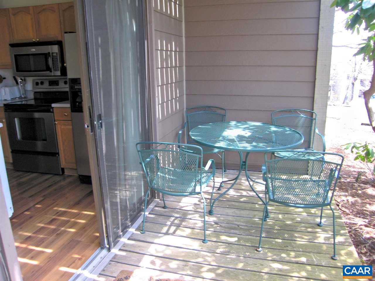 462 Three Ridges Roseland, VA 22967 - Photo 8 of 25 a table and chairs in a glass room
