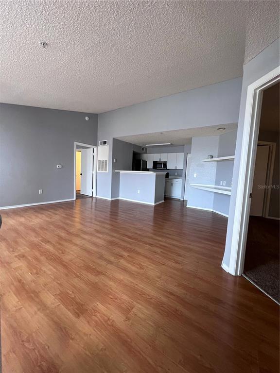 2202 Key W Court, Unit 633 Kissimmee, FL 34741 - Photo 11 of 33 a view of empty room with wooden floor