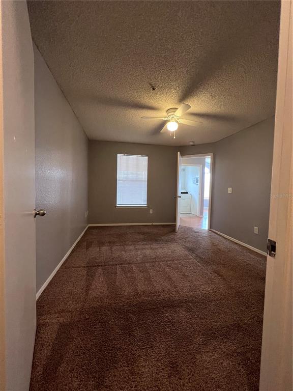 2202 Key W Court, Unit 633 Kissimmee, FL 34741 - Photo 17 of 33 a view of an empty room with a window