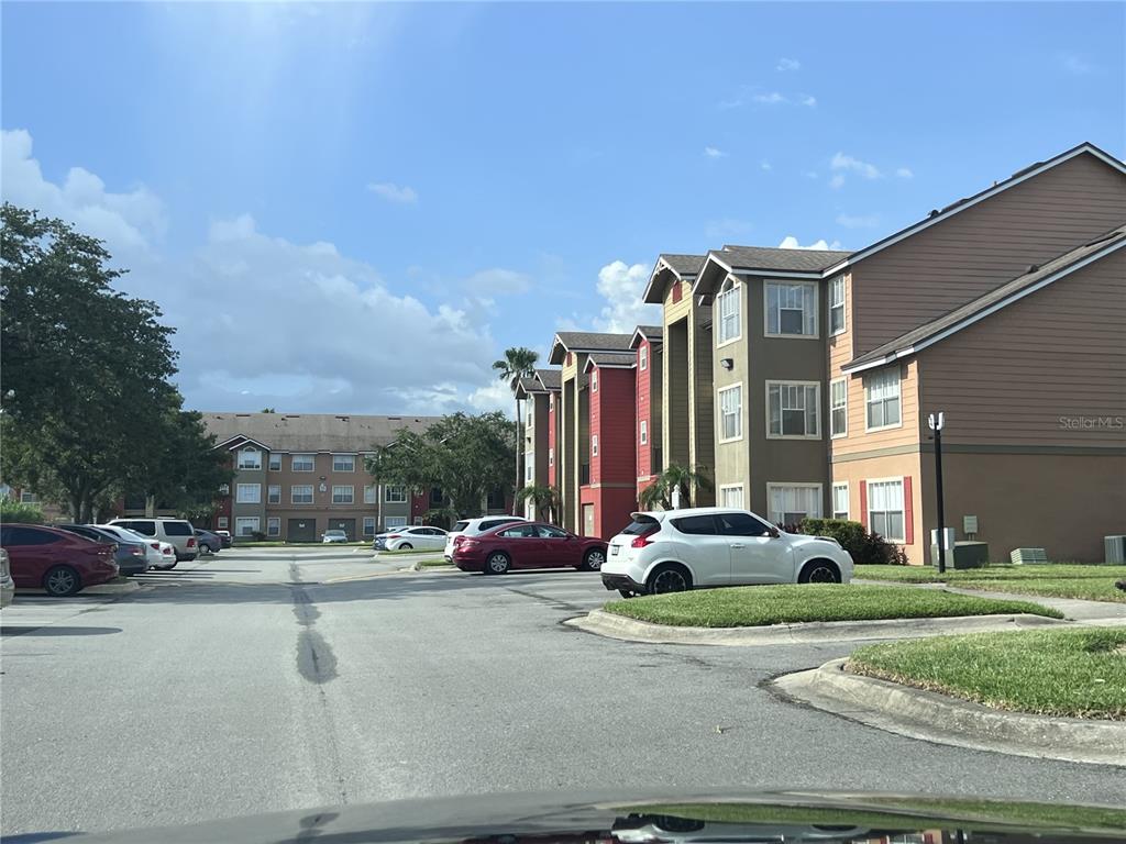 2202 Key W Court, Unit 633 Kissimmee, FL 34741 - Photo 29 of 33 a view of a cars parked in front of a building