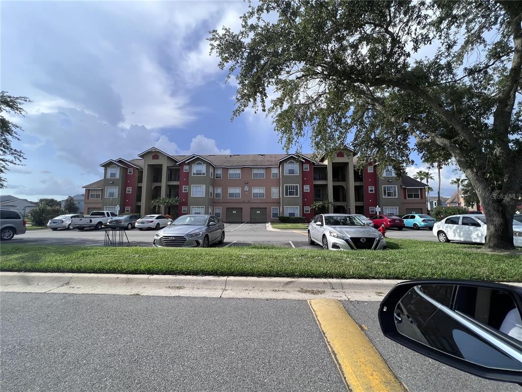 2202 Key W Court, Unit 633 Kissimmee, FL 34741 - Photo 30 of 33 a view of a street with houses and a street view