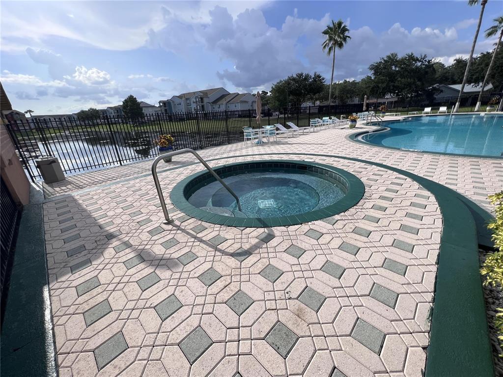 2202 Key W Court, Unit 633 Kissimmee, FL 34741 - Photo 31 of 33 a view of a swimming pool with a yard