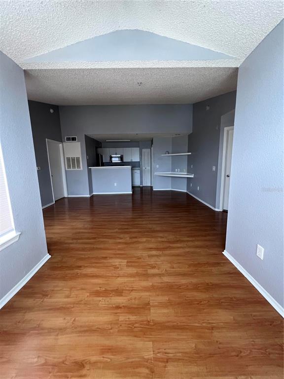2202 Key W Court, Unit 633 Kissimmee, FL 34741 - Photo 4 of 33 a view of empty room with wooden floor