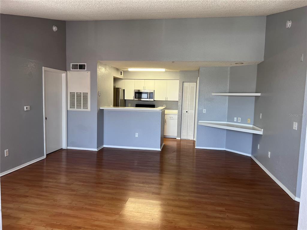 2202 Key W Court, Unit 633 Kissimmee, FL 34741 - Photo 7 of 33 a view of a kitchen with wooden floor and a kitchen