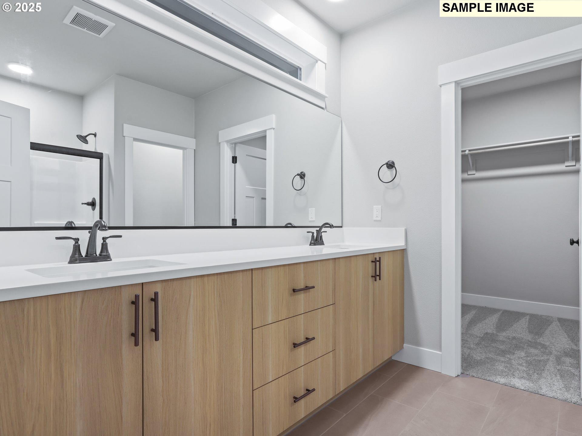 2240 East Otter Loop, Unit 52 La Center, WA 98629 - Photo 27 of 43 a bathroom with a double vanity sink and mirror