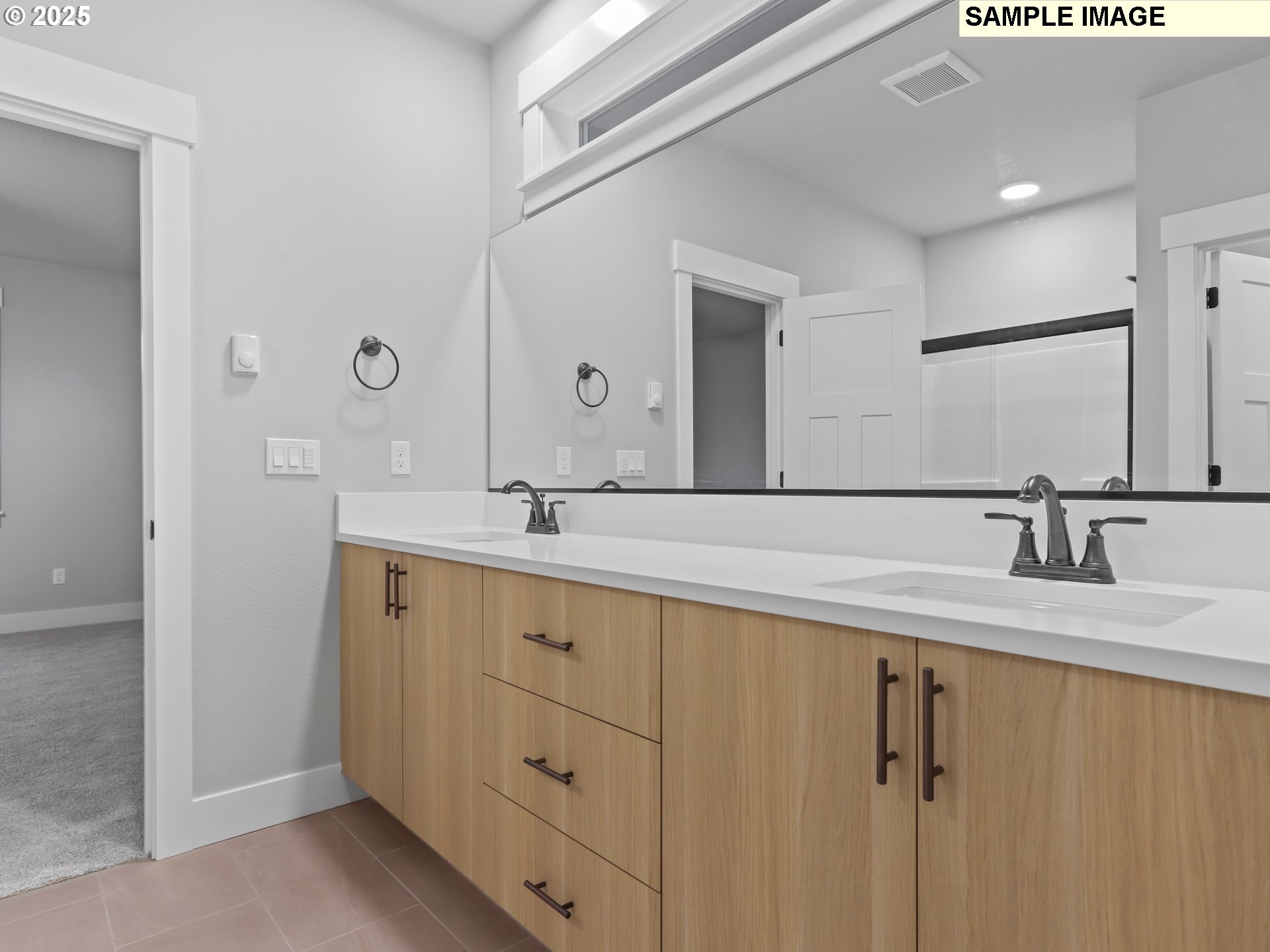 2240 East Otter Loop, Unit 52 La Center, WA 98629 - Photo 28 of 43 a bathroom with a double vanity sink and mirror