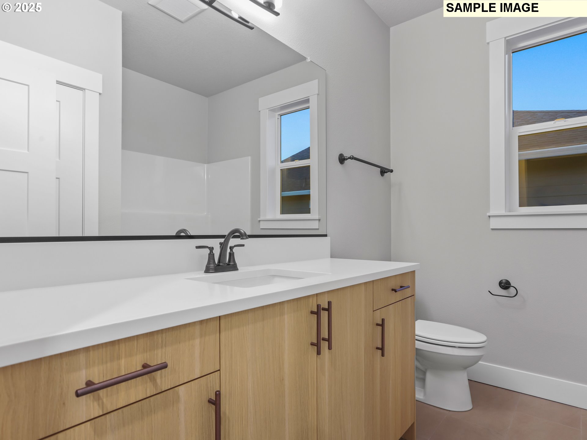 2240 East Otter Loop, Unit 52 La Center, WA 98629 - Photo 29 of 43 a bathroom with a granite countertop sink toilet and mirror