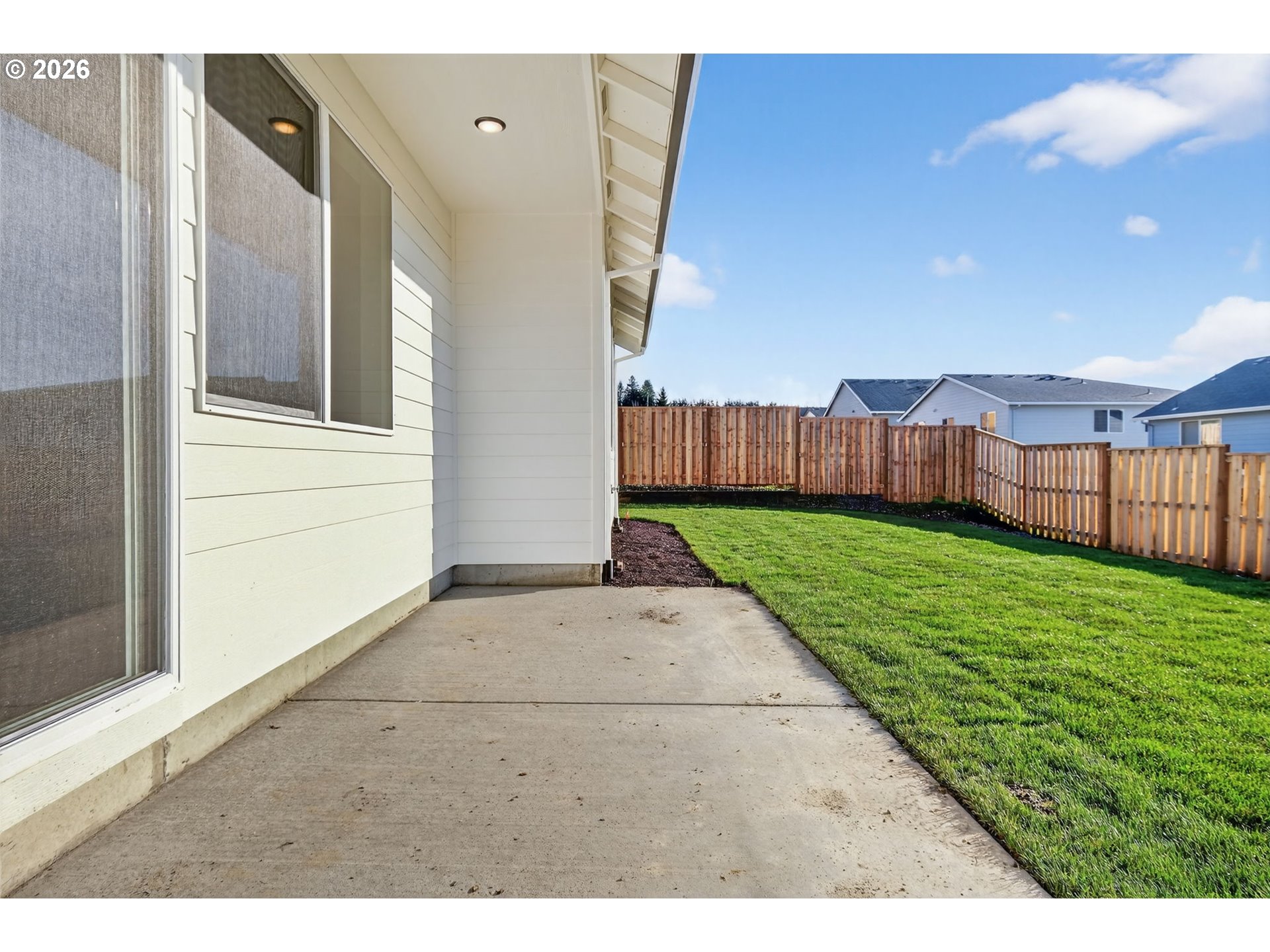 2240 East Otter Loop, Unit 52 La Center, WA 98629 - Photo 35 of 43 a view of backyard with barbeque grill and wooden fence