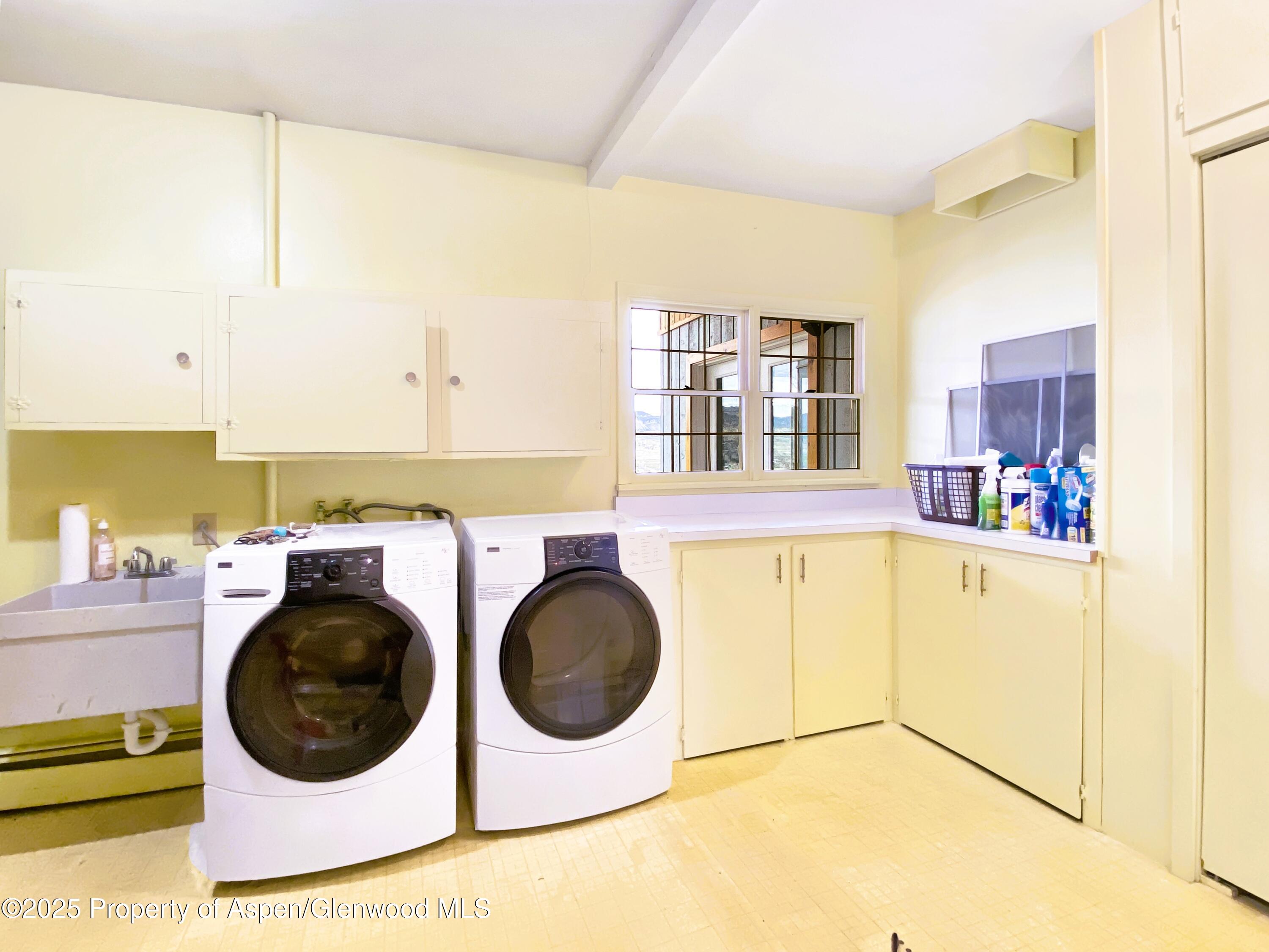1509 County Road 4 Meeker, CO 81641 - Photo 14 of 37 a view of a kitchen with a washer and dryer