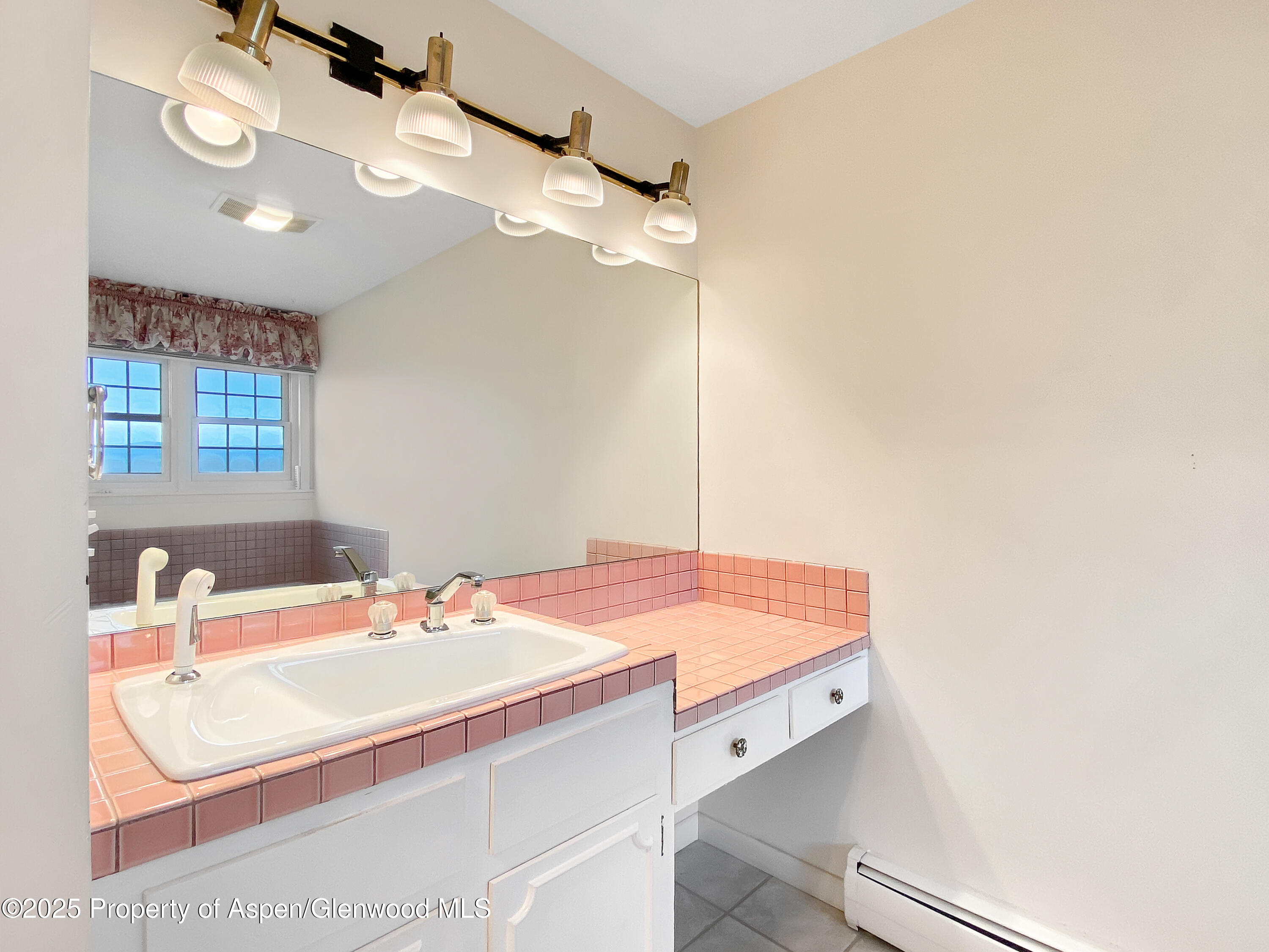 1509 County Road 4 Meeker, CO 81641 - Photo 19 of 37 a bathroom with a sink and a mirror