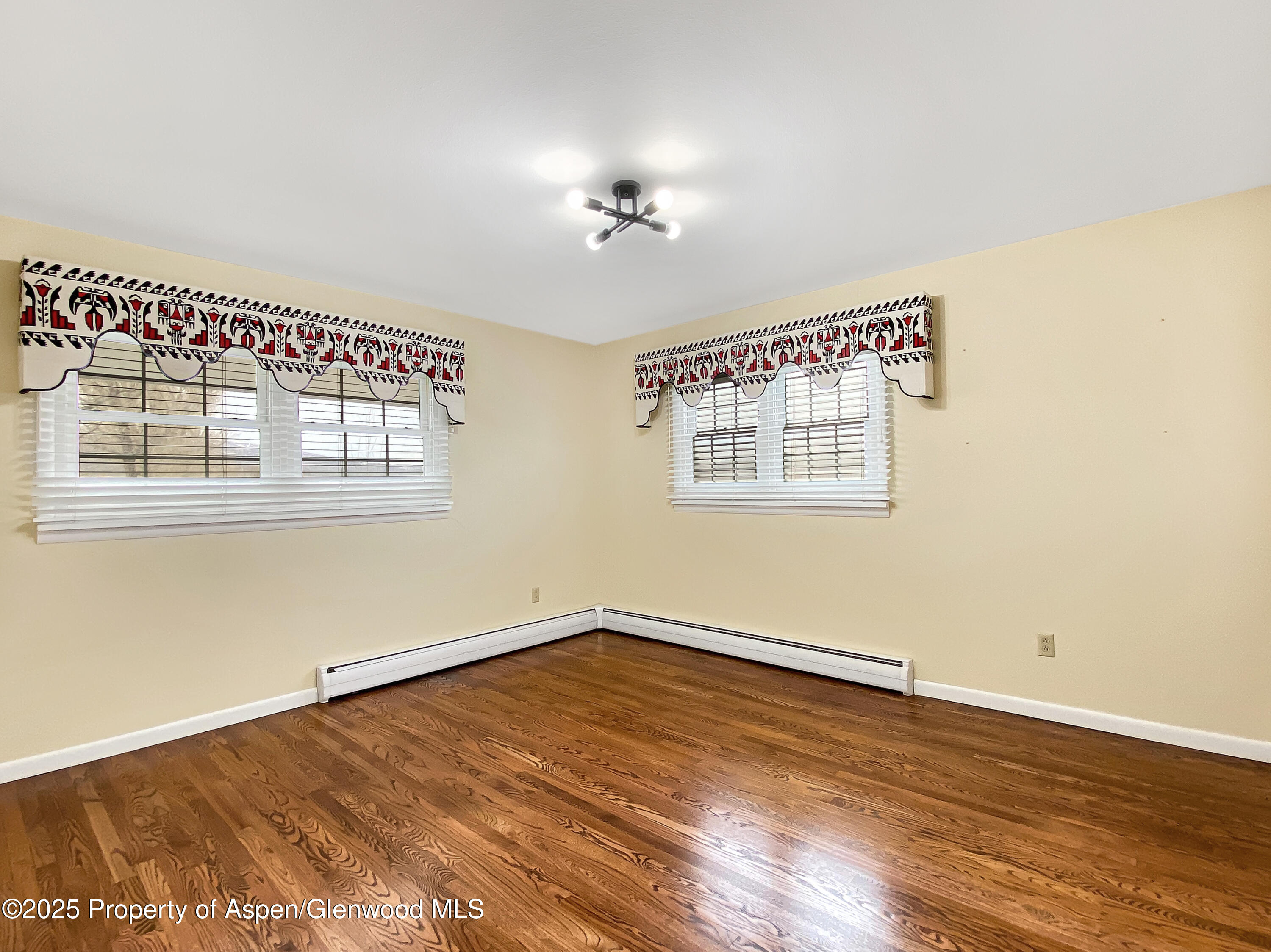 1509 County Road 4 Meeker, CO 81641 - Photo 23 of 37 a view of an empty room with wooden floor and a window