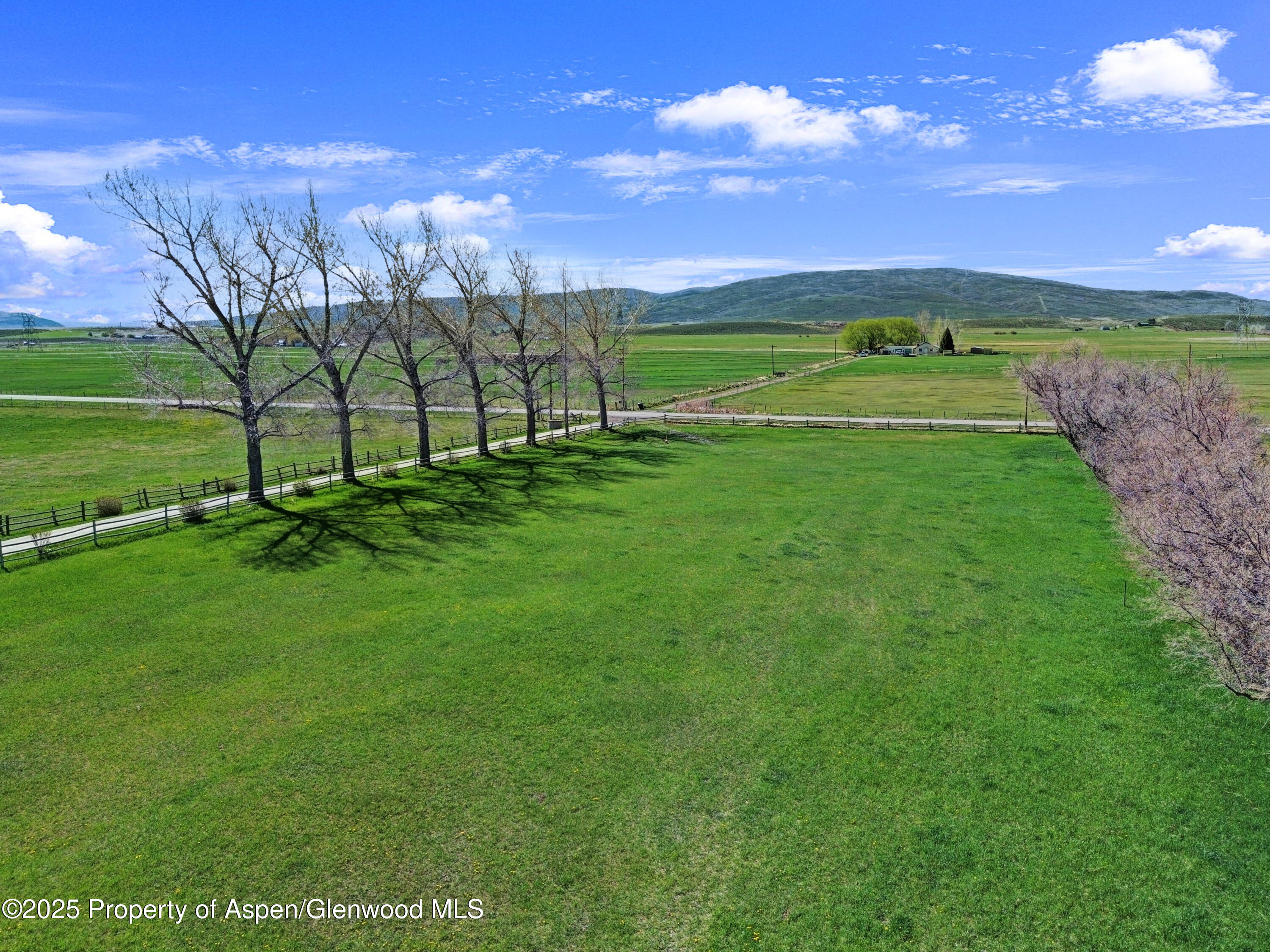 1509 County Road 4 Meeker, CO 81641 - Photo 33 of 37 a view of a golf course with a building in the background