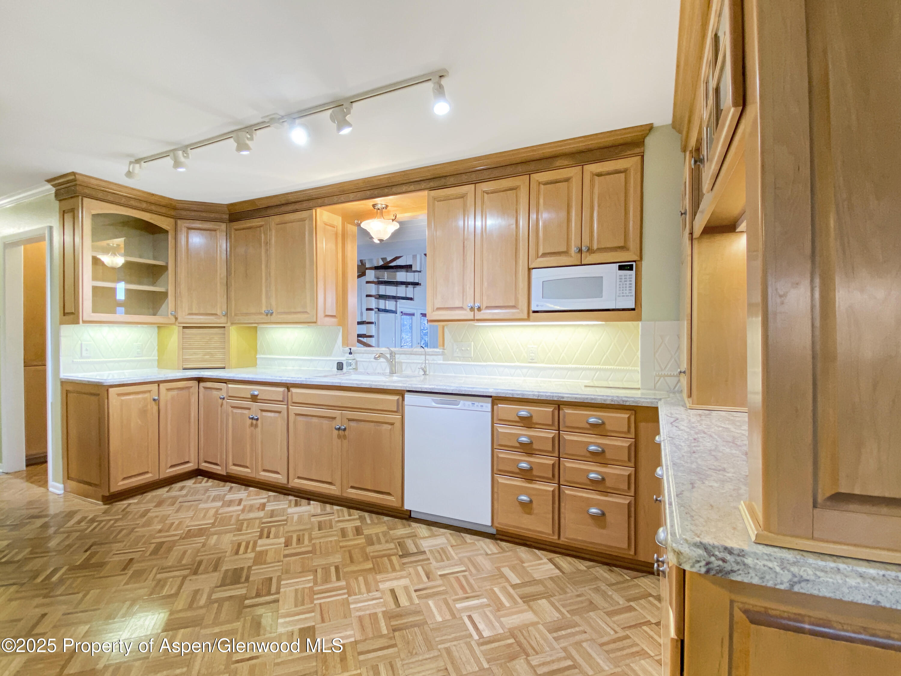 1509 County Road 4 Meeker, CO 81641 - Photo 7 of 37 a kitchen with stainless steel appliances a sink and cabinets