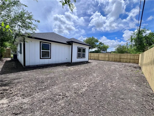 a backyard of a house with lots of green space