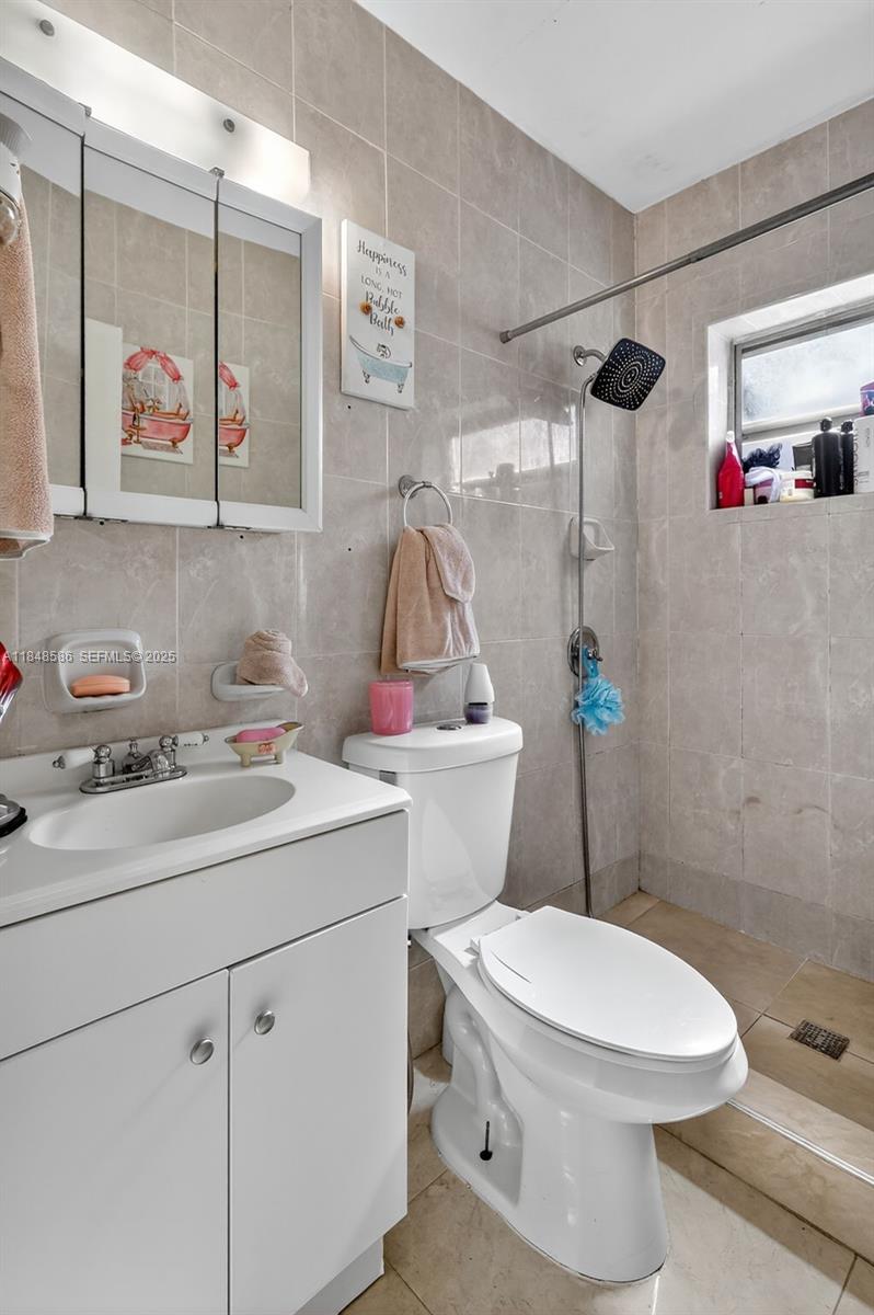 3581 West 2nd Avenue Hialeah, FL 33012 - Photo 13 of 32 a bathroom with a sink toilet and shower