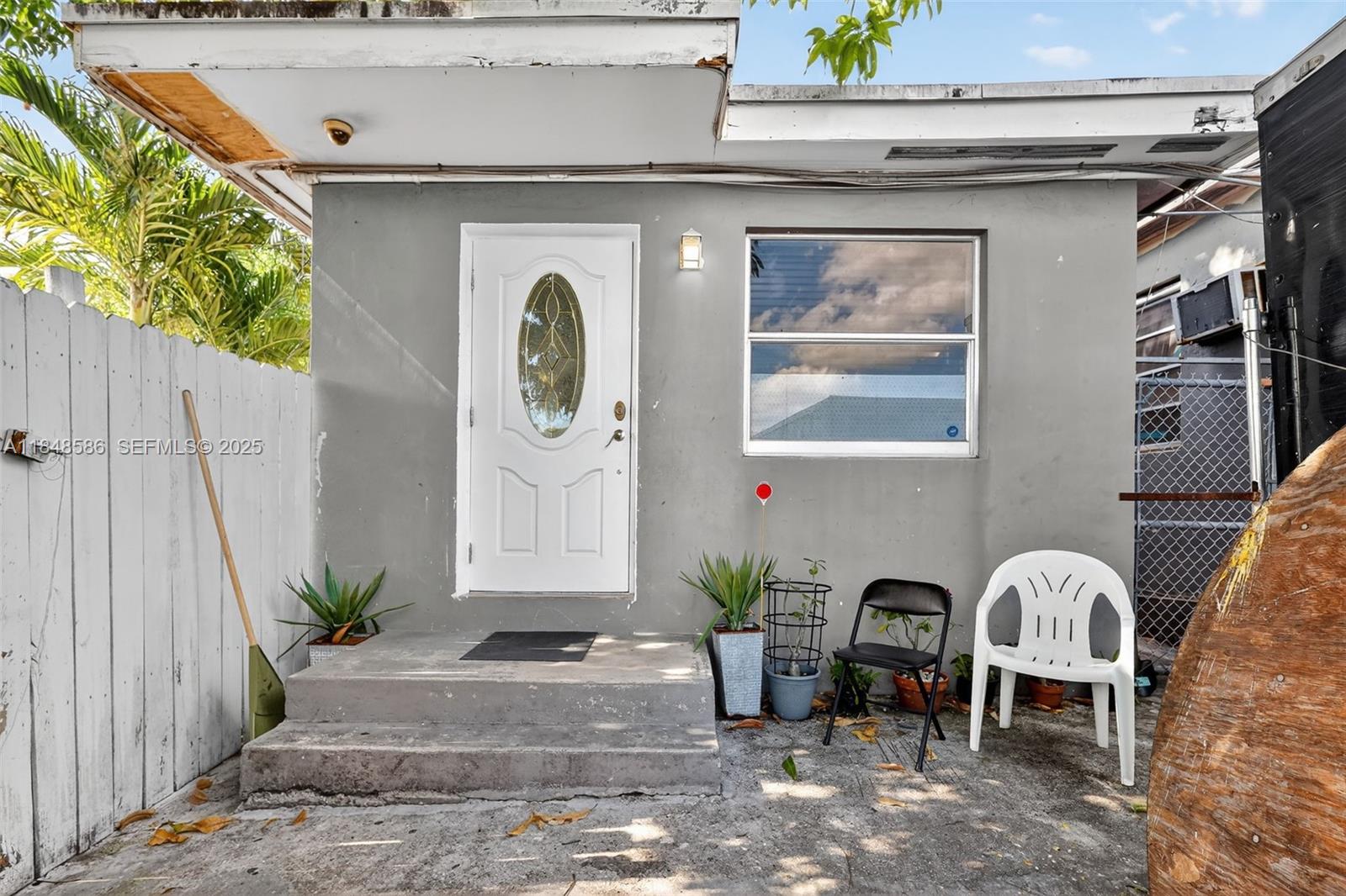 3581 West 2nd Avenue Hialeah, FL 33012 - Photo 16 of 32 a front view of a house with outdoor seating