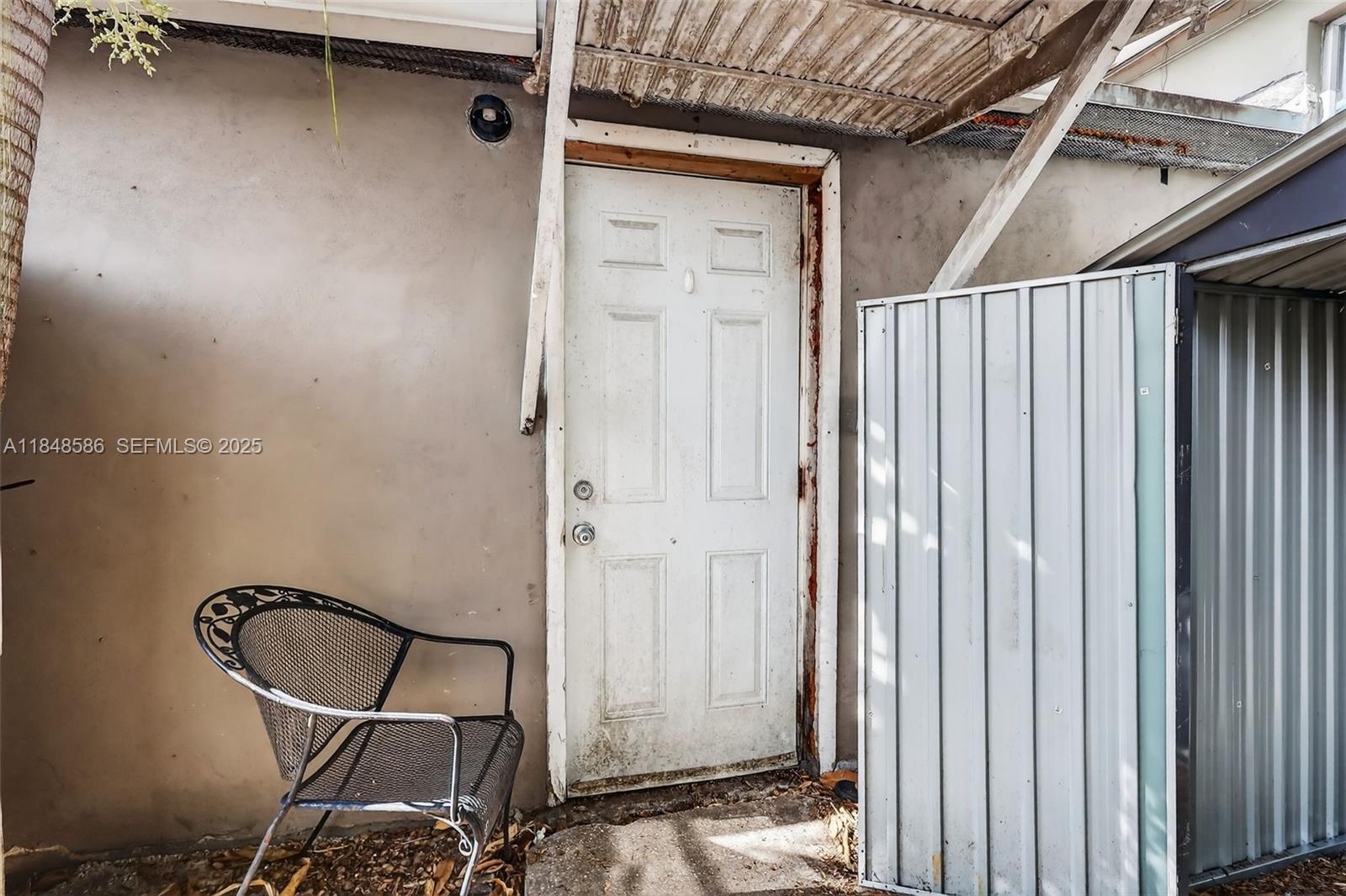 3581 West 2nd Avenue Hialeah, FL 33012 - Photo 22 of 32 a view of a door and chair and door