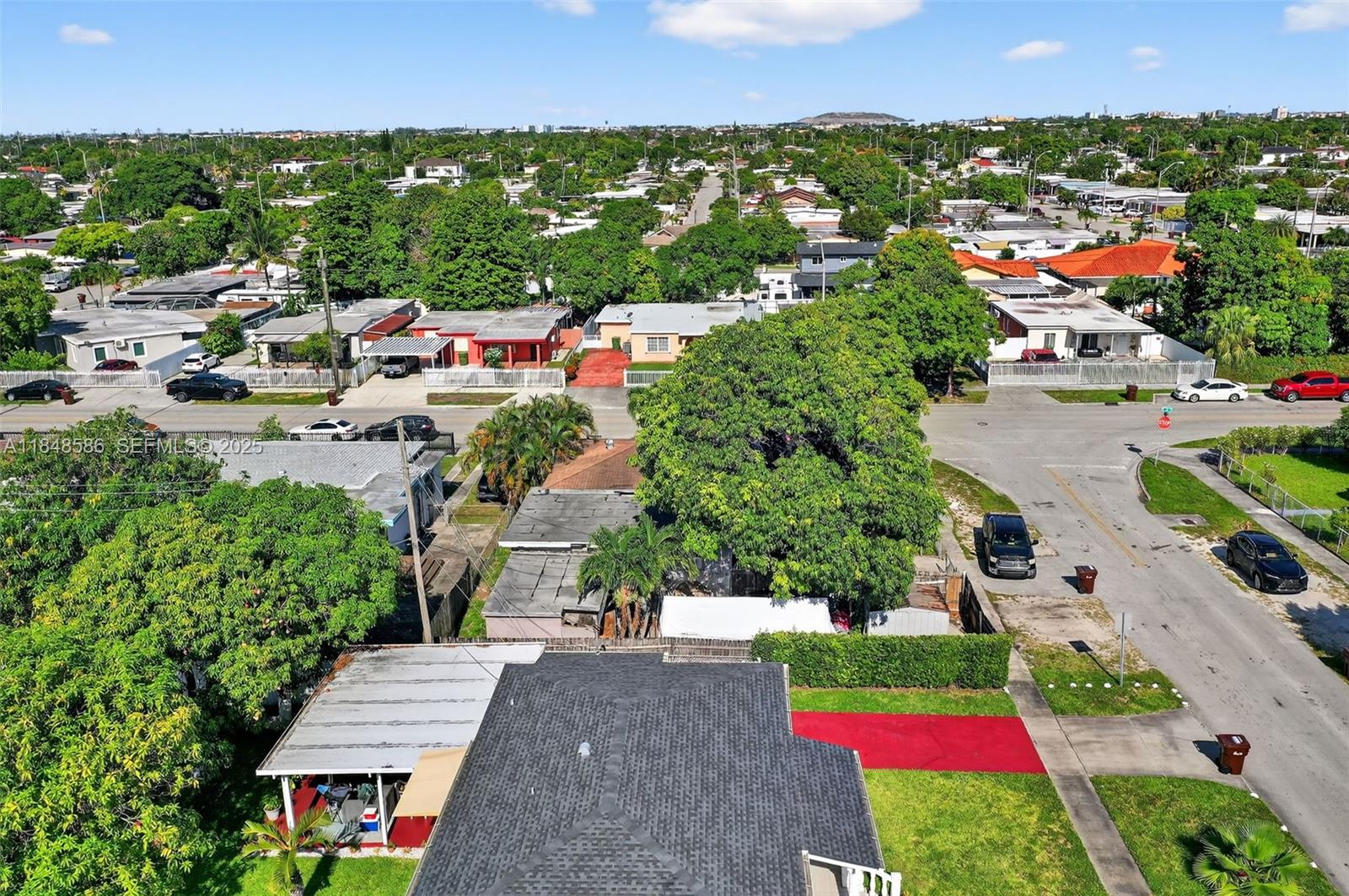 3581 West 2nd Avenue Hialeah, FL 33012 - Photo 31 of 32 an aerial view of multiple houses with yard