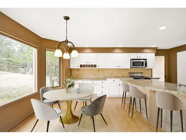 a living room with a flat screen tv and a potted plant