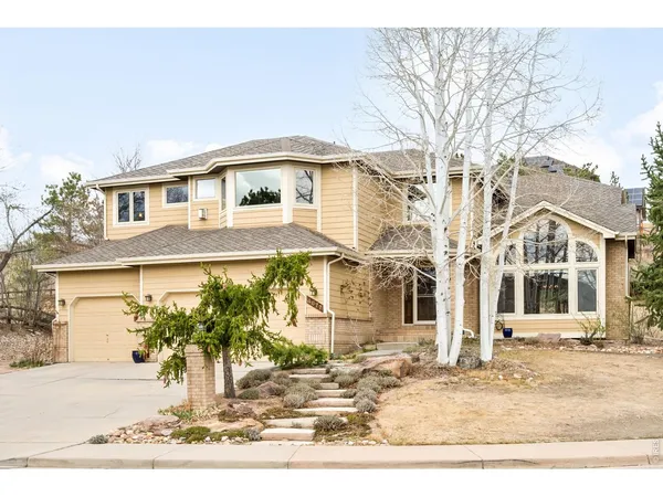 a view of a door of the house with a door and a window