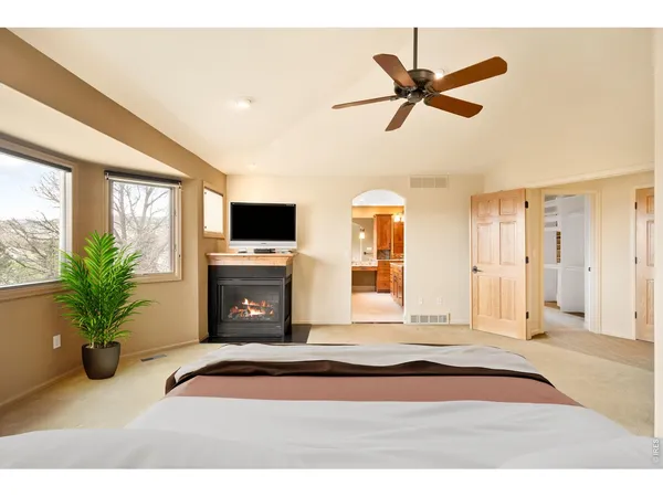 a bathroom with a granite countertop sink a mirror and a shower