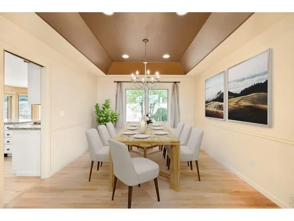 a kitchen with granite countertop a refrigerator and a sink