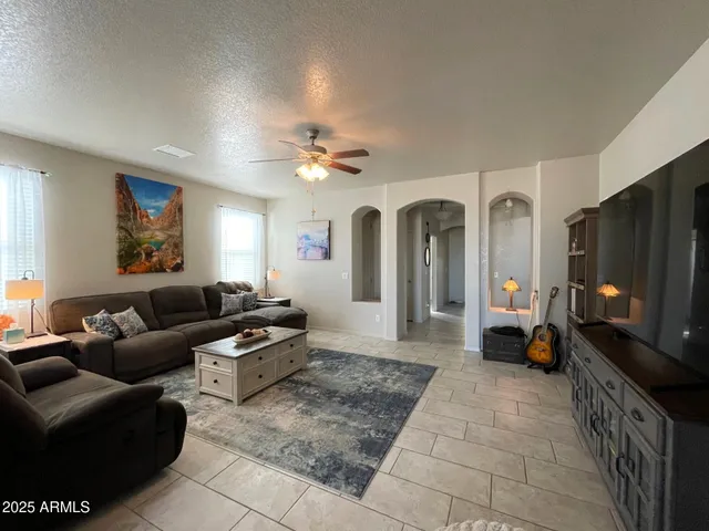 a large kitchen with kitchen island a sink table and chairs