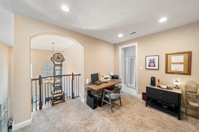 a room with furniture a air conditioner and a window