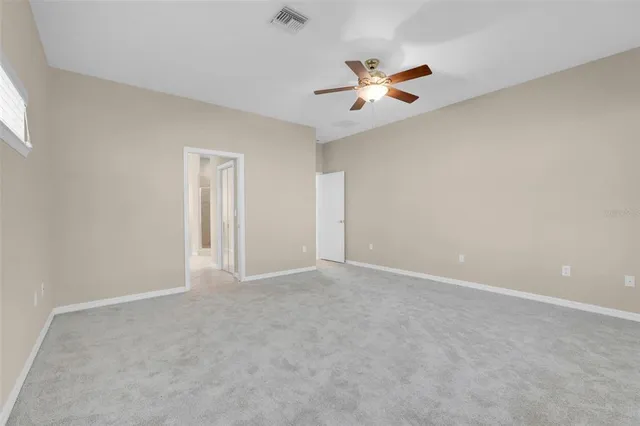 a bathroom with a sink a large mirror and a shower