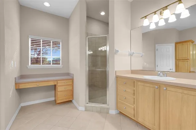 a bathroom with a mirror and a shower